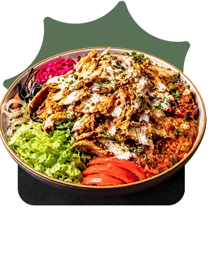 Chicken shawarma bowl with tahini, lettuce, tomato, and pickled red cabbage